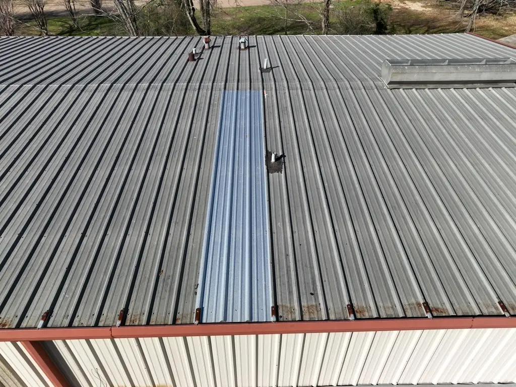 replaced R-Panel metal roof that was causing leak