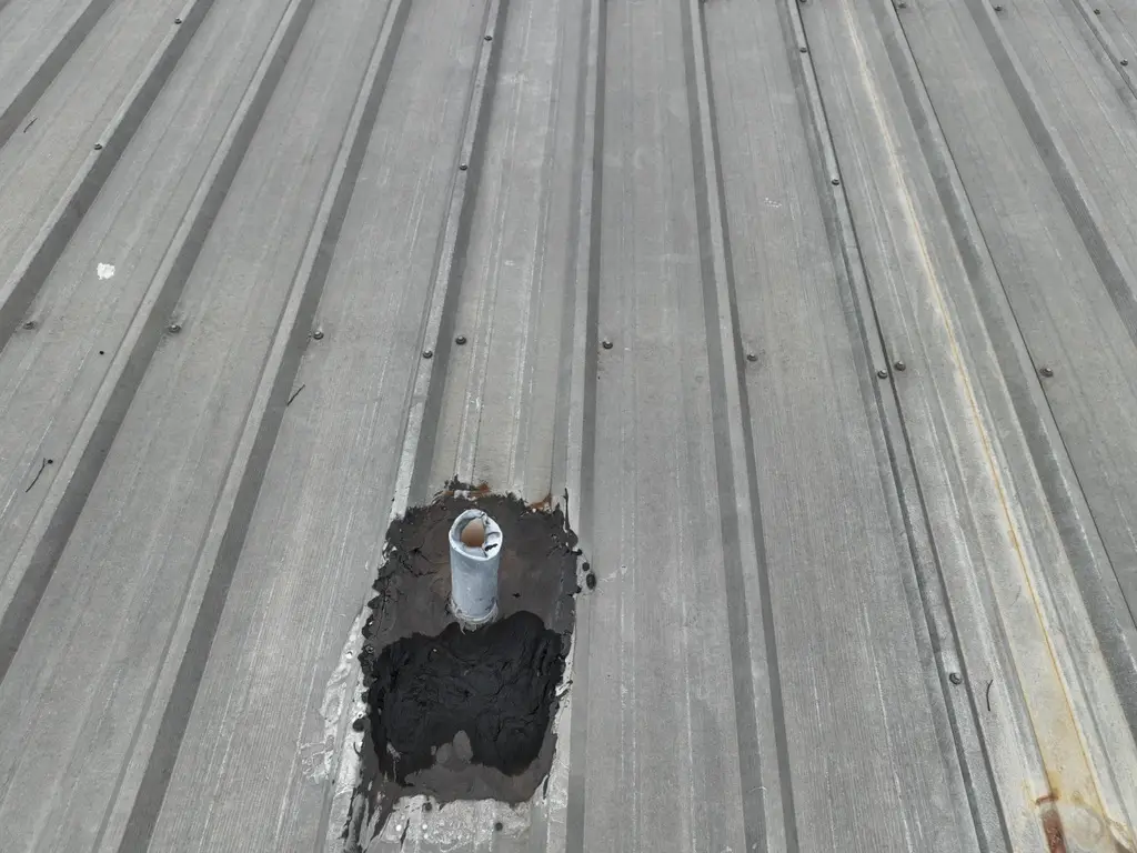 damaged leaking area in r-panel metal roof