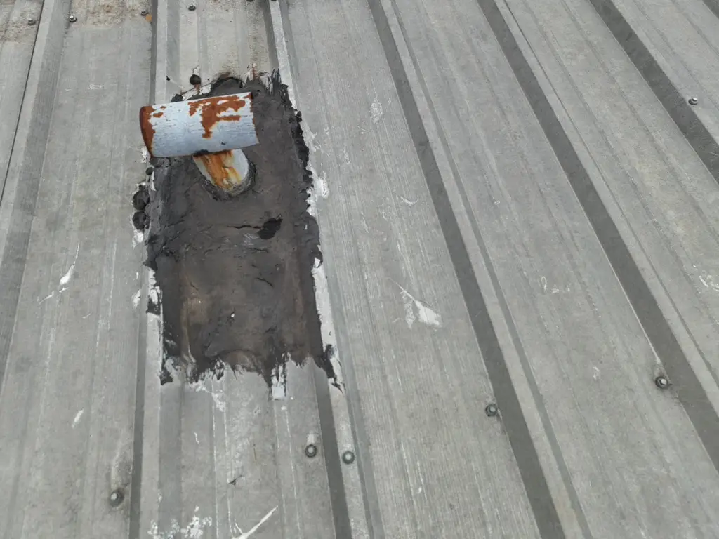damaged leaking area in r-panel metal roof
