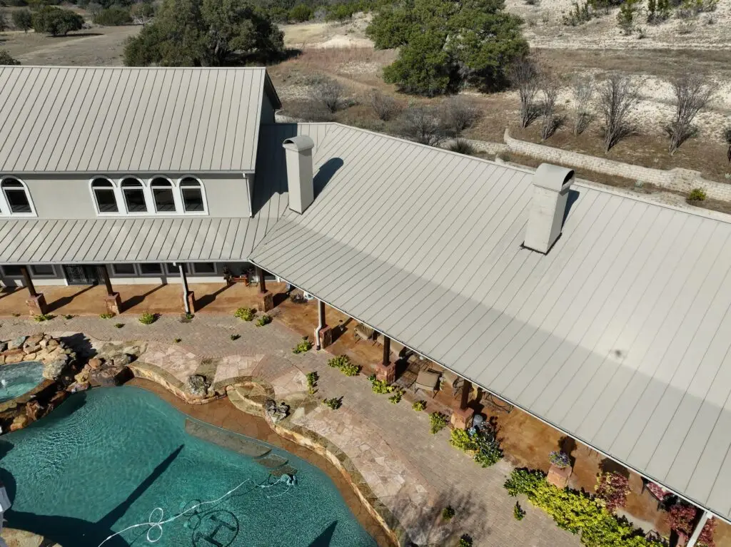 Chimney flashing replacement on standing seam metal roof – East Texas