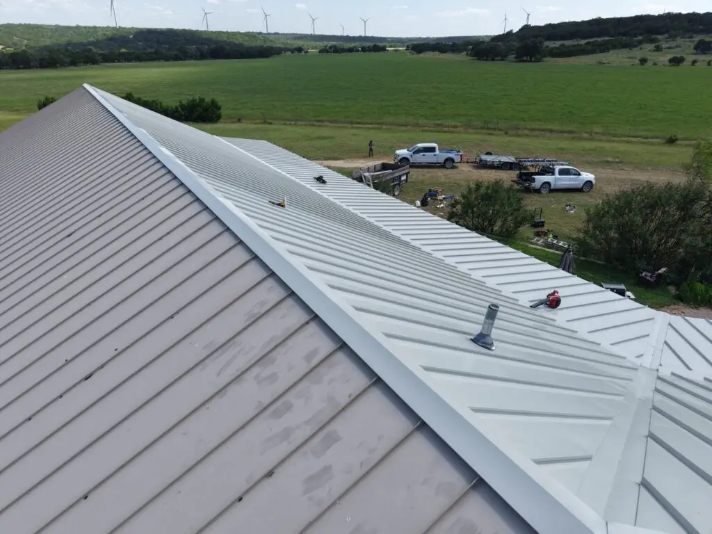 Chimney flashing replacement on standing seam metal roof – East Texas