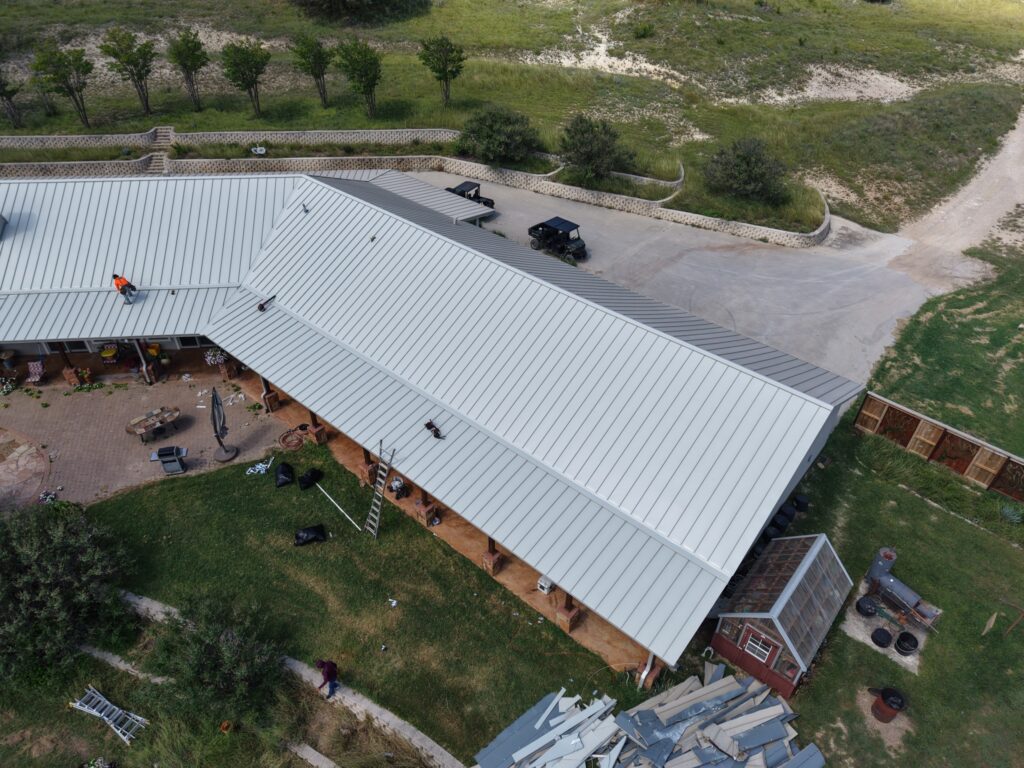 Chimney flashing replacement on standing seam metal roof – East Texas