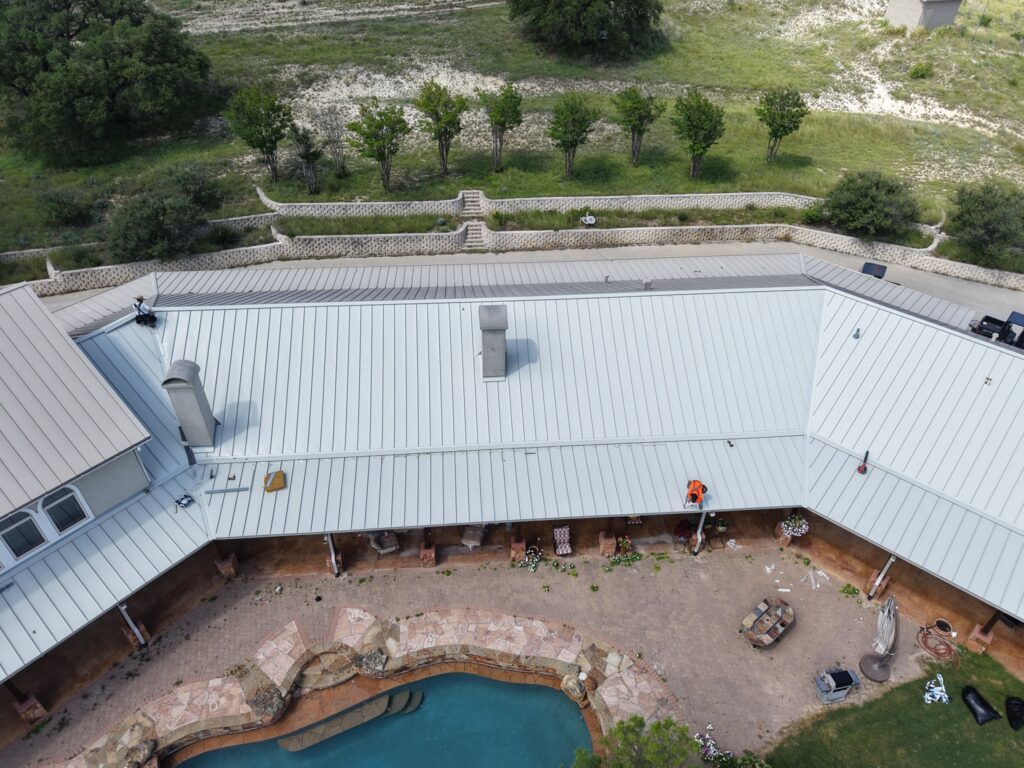 Chimney flashing replacement on standing seam metal roof – East Texas