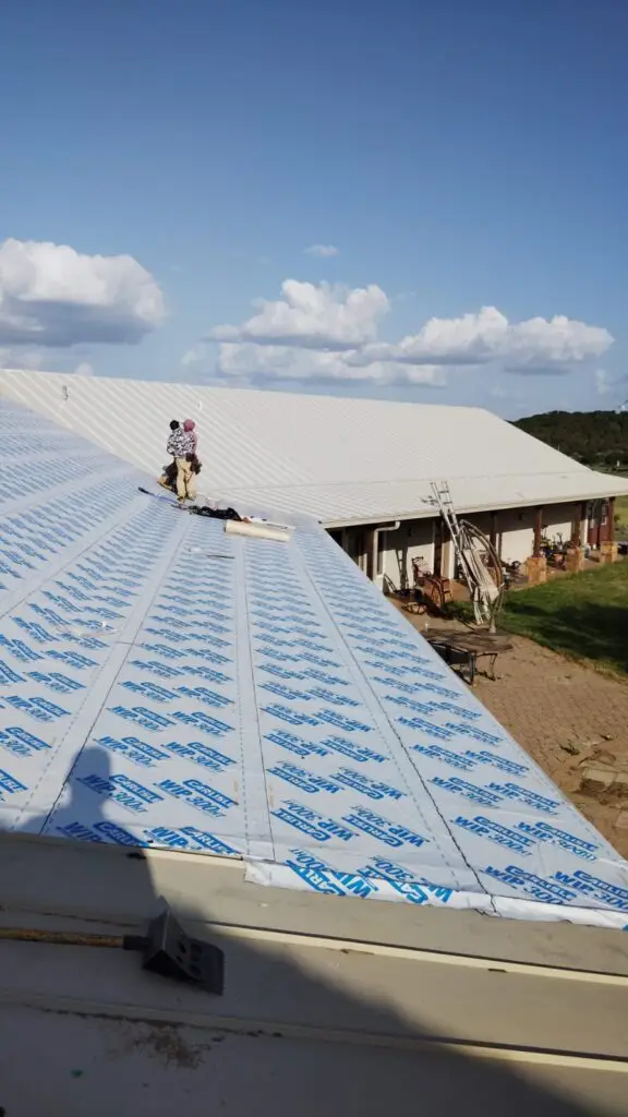 Chimney flashing replacement on standing seam metal roof – East Texas