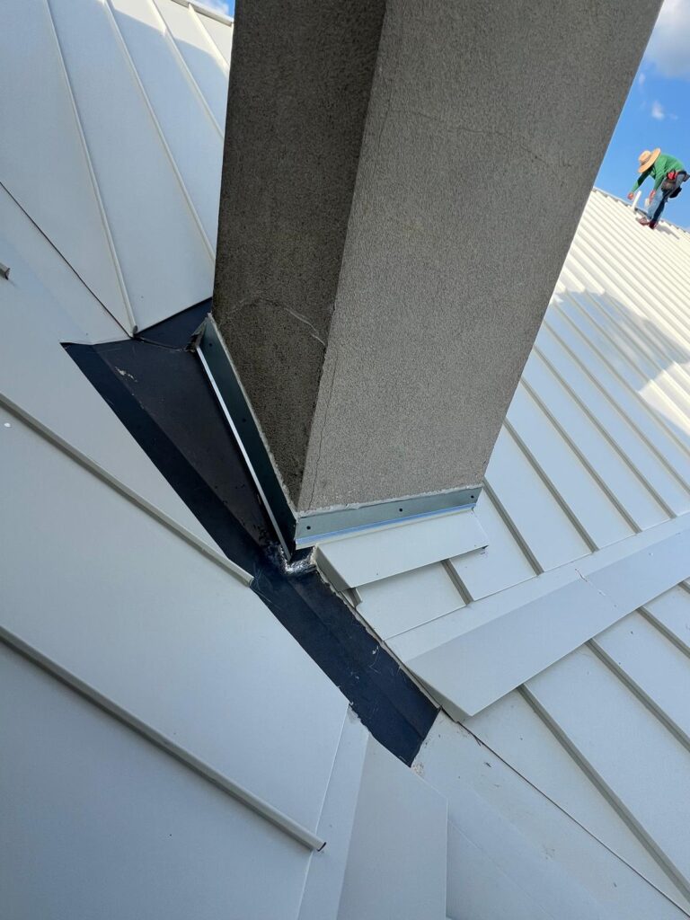 Chimney flashing replacement on standing seam metal roof – East Texas