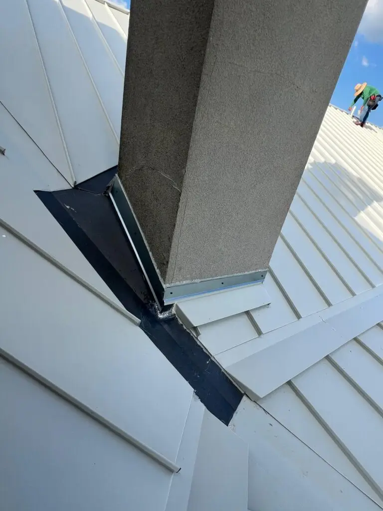 Chimney flashing replacement on standing seam metal roof – East Texas