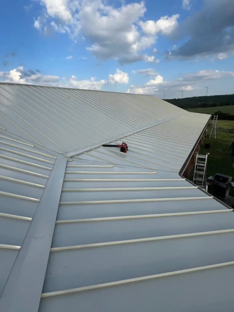 Chimney flashing replacement on standing seam metal roof – East Texas