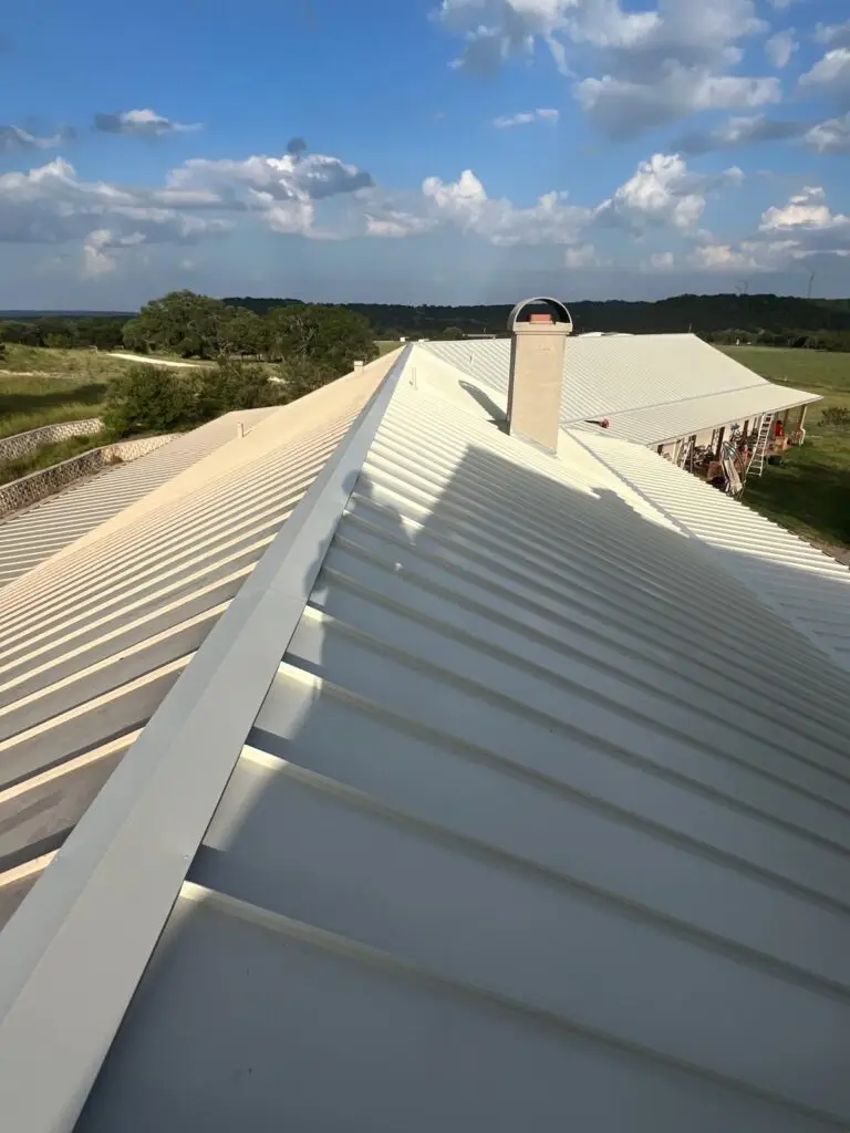 Chimney flashing replacement on standing seam metal roof – East Texas