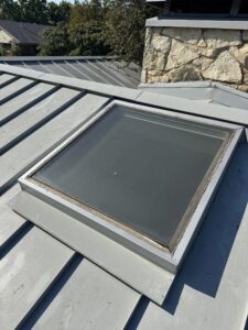 Closer look of completed metal roof repair skylight